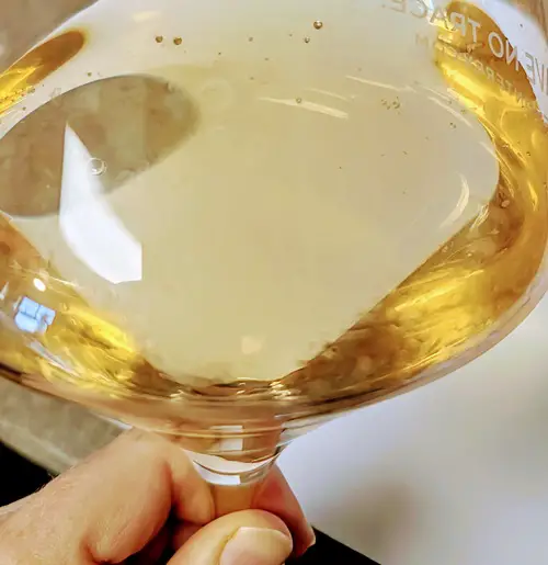 What Happens If You Drink Old Opened Wine? - old chardonnay in wine glass