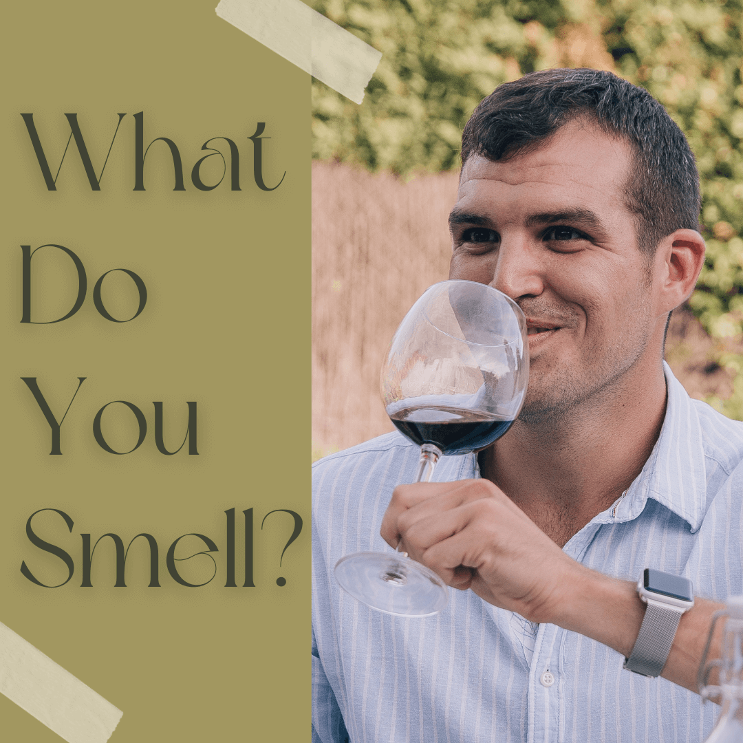 Man smelling red wine - smell wine with your mouth open