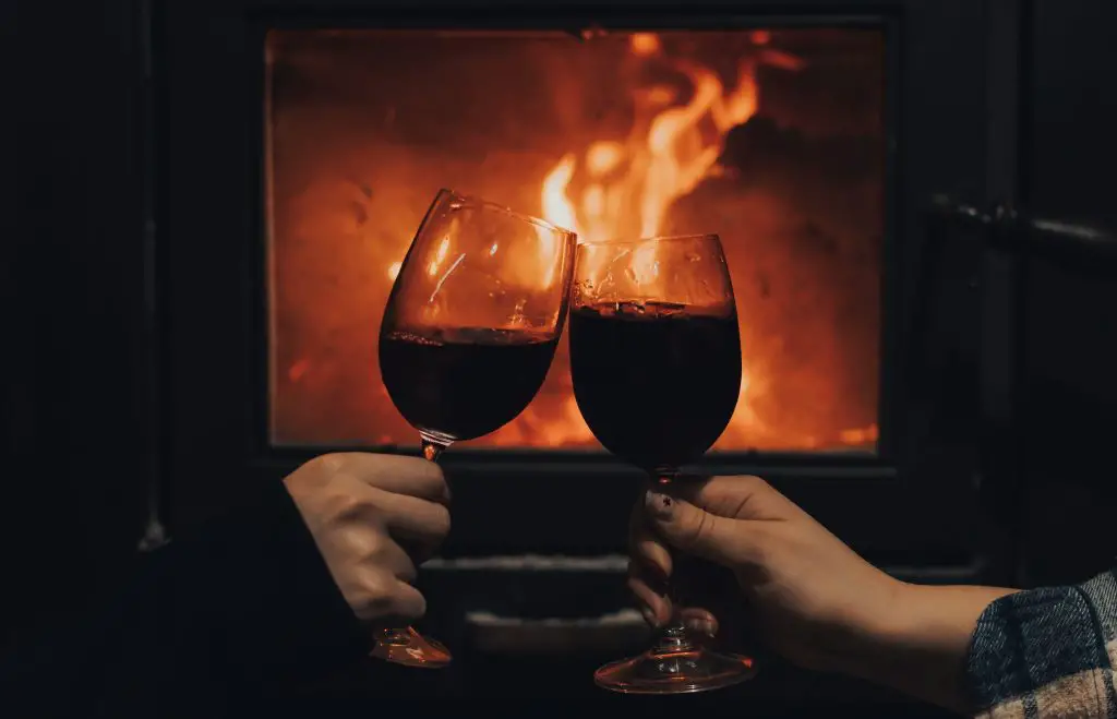 petite-sirah-wine-guide - fireside red wine glasses