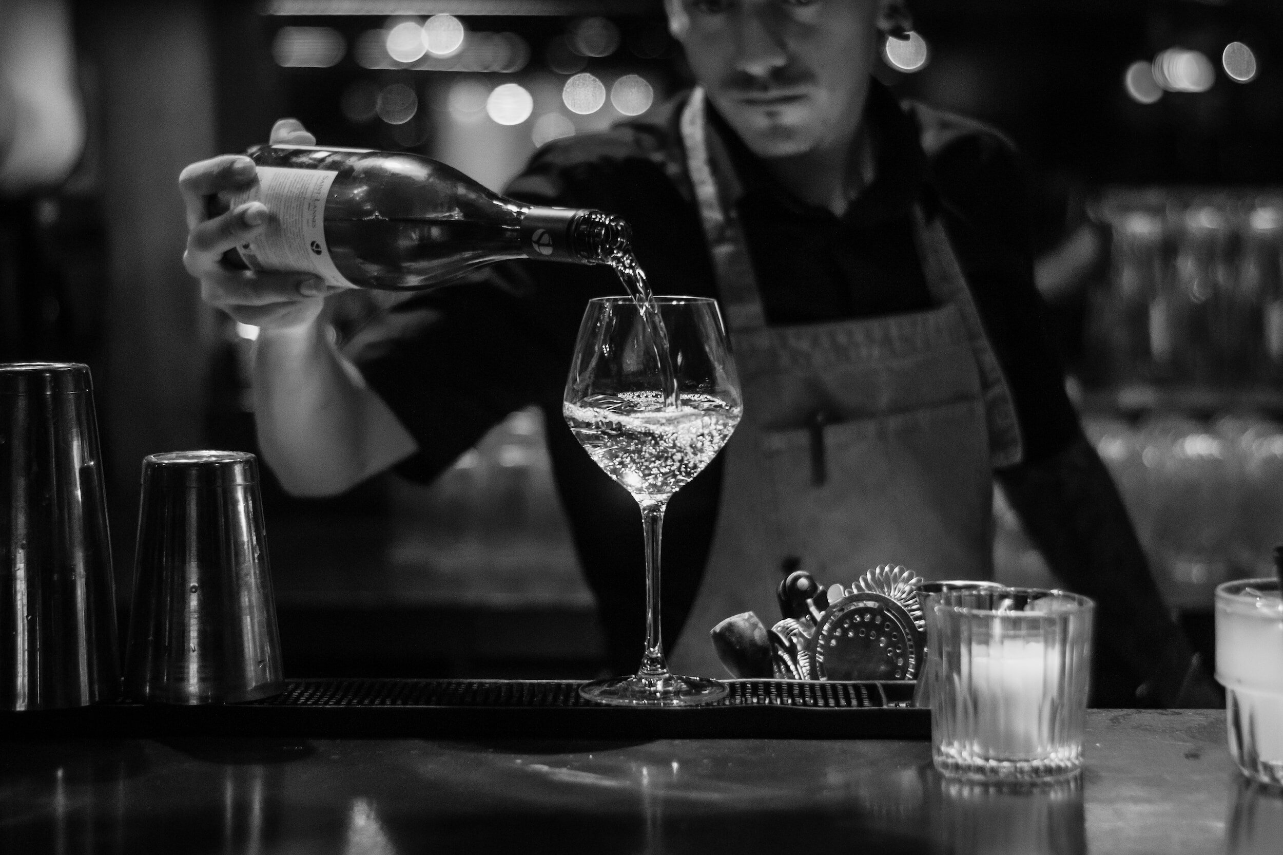 wine pairing spicy food - pouring white wine glass