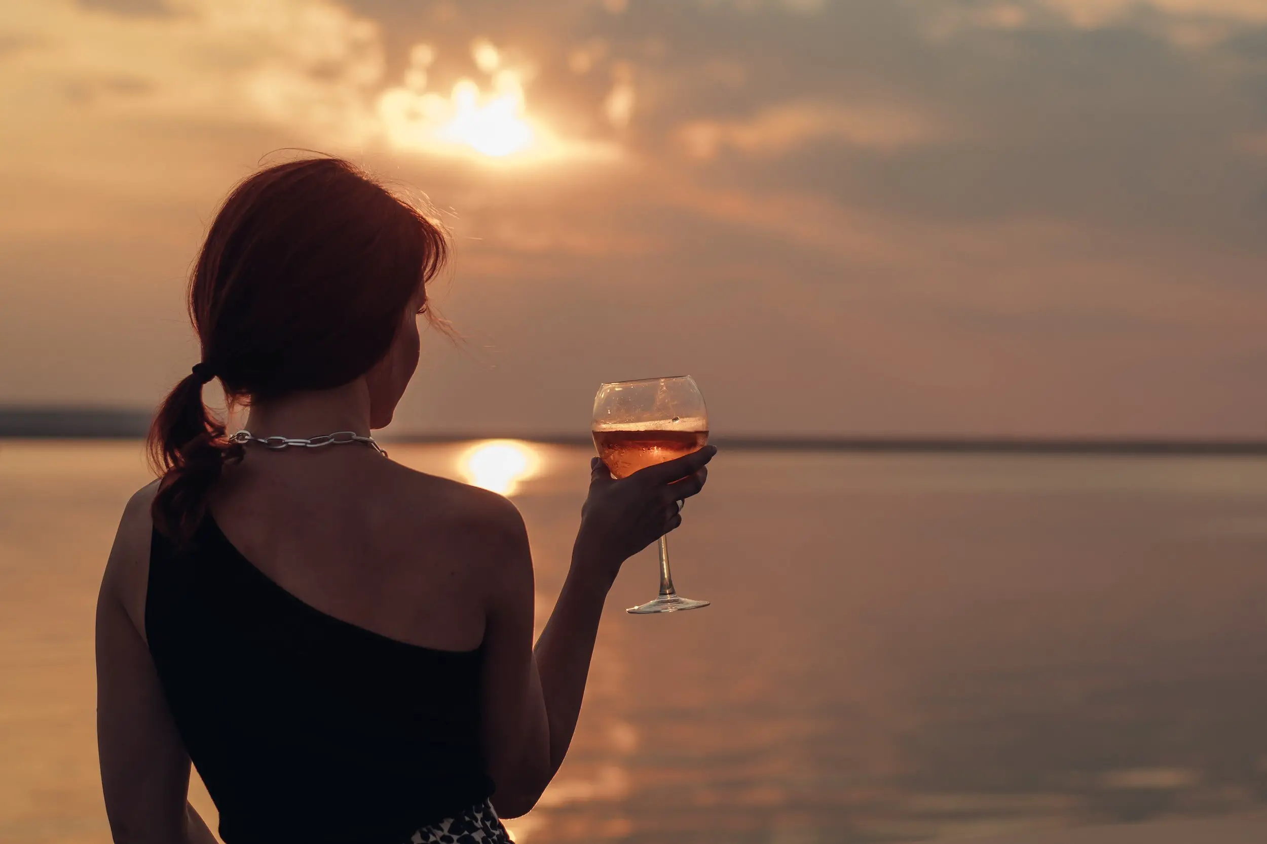 how alcohol affects wine - sunset and wine glass