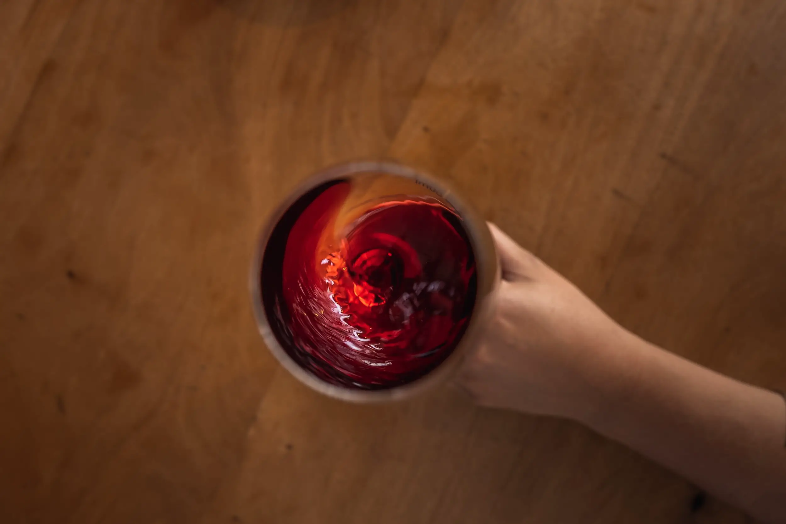 merlot growing regions - swirling glass of wine