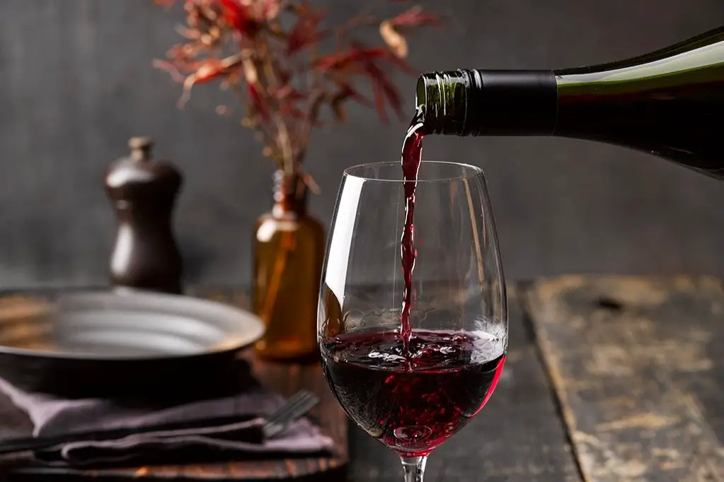red wine pouring - affordable wine for beginners