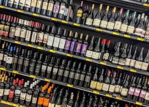 wines for beginners - grocery store shelf of wine