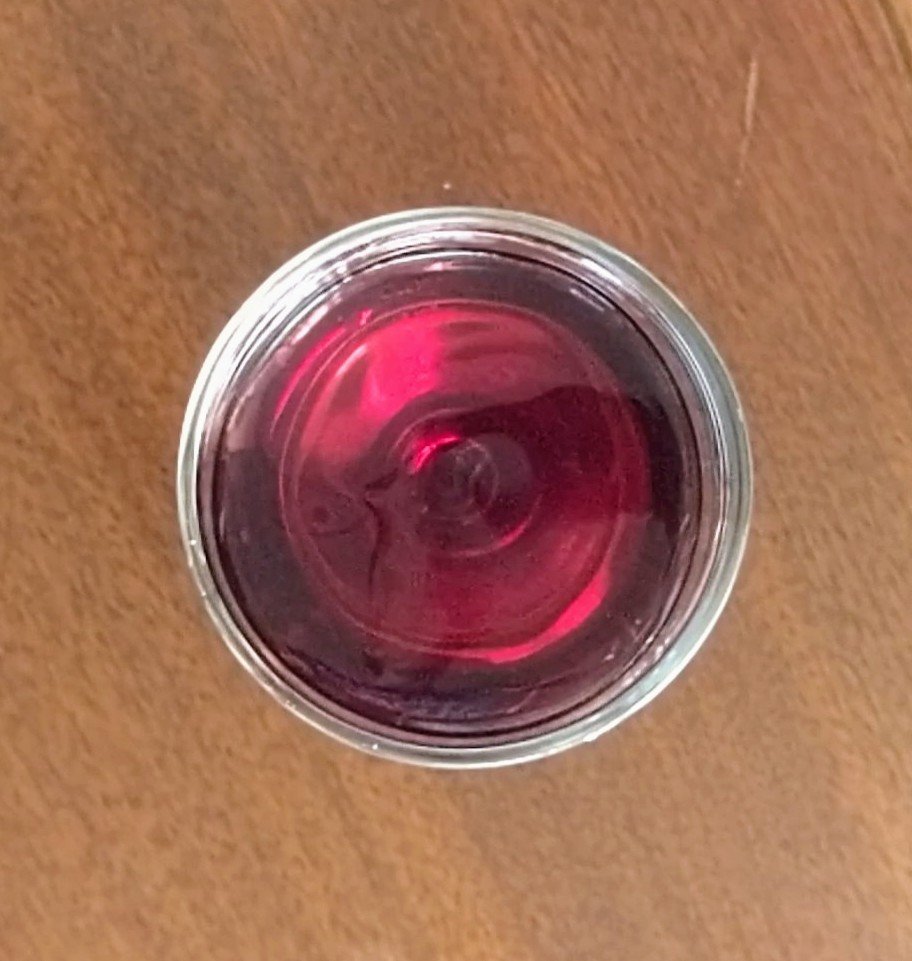 swirling wine - red wine glass