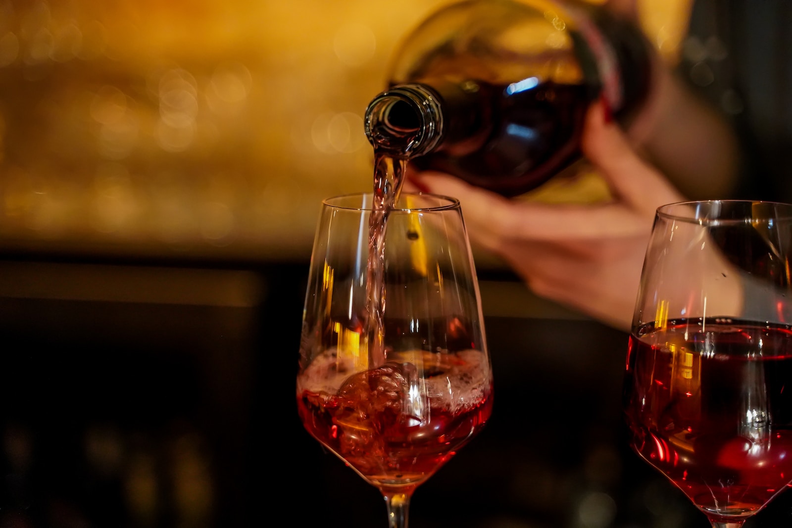 wine bottle pouring on wine glass - why are some wines sweet