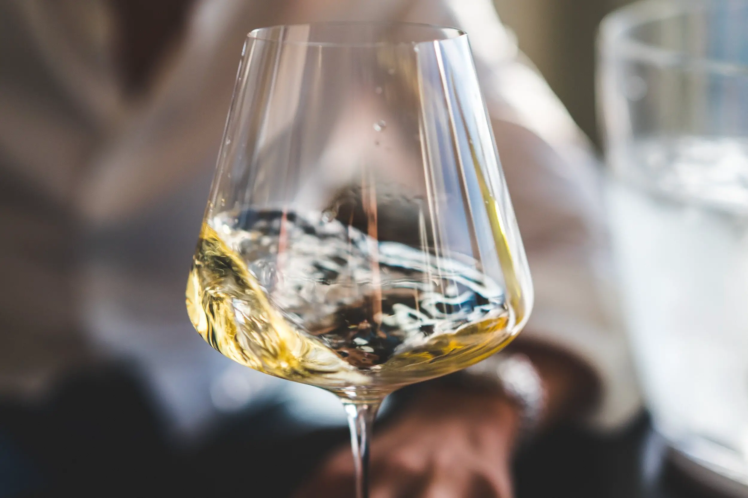 how to tell if a white wine is bad - swirling white wine glass