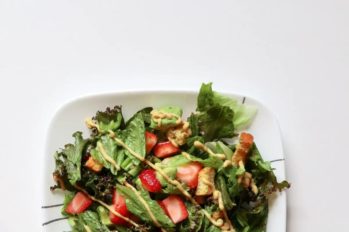 vegetables with strawberries on white plate - syrah vs grenache wine