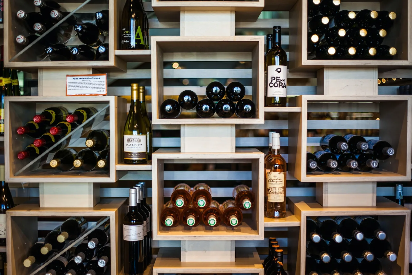 brown wooden wine bottle rack - pinot grigio vs merlot wine