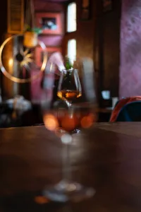 clear wine glass on brown wooden table