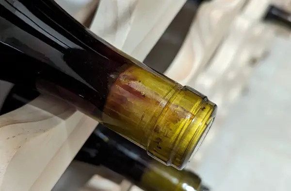 how to tell if wine has gone bad without opening it - wine bleeding through cork is fine